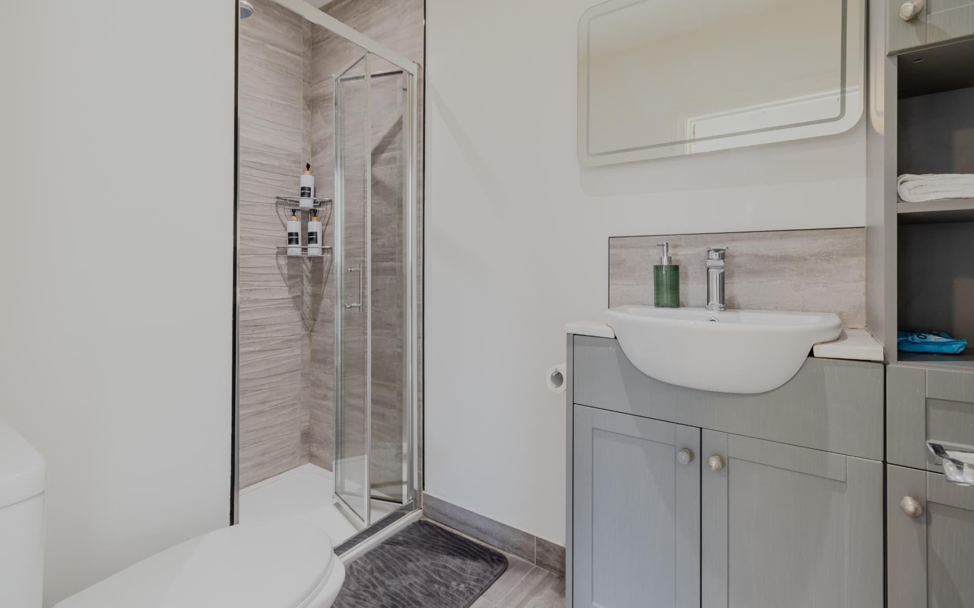 Shower room with vanity unit and fresh towels